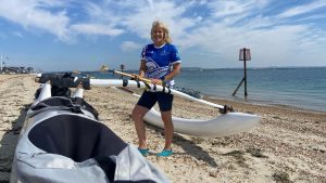 Philippa Taylor and an outrigger canoe